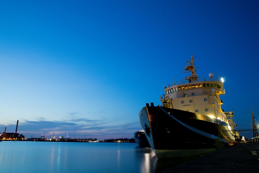Ship docked at port during blue hour